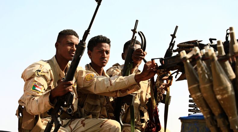 FILE - Sudanese soldiers from the Rapid Support Forces unit patrol during a rally for Dagalo, in Garawee town, north of Sudan, Saturday, June 15, 2019. (AP Photo)