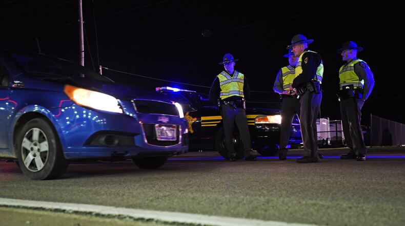 The Butler County OVI Task Force at a sobriety checkpoint to check for impaired drivers last year along US 127 in New Miami. NICK GRAHAM/STAFF