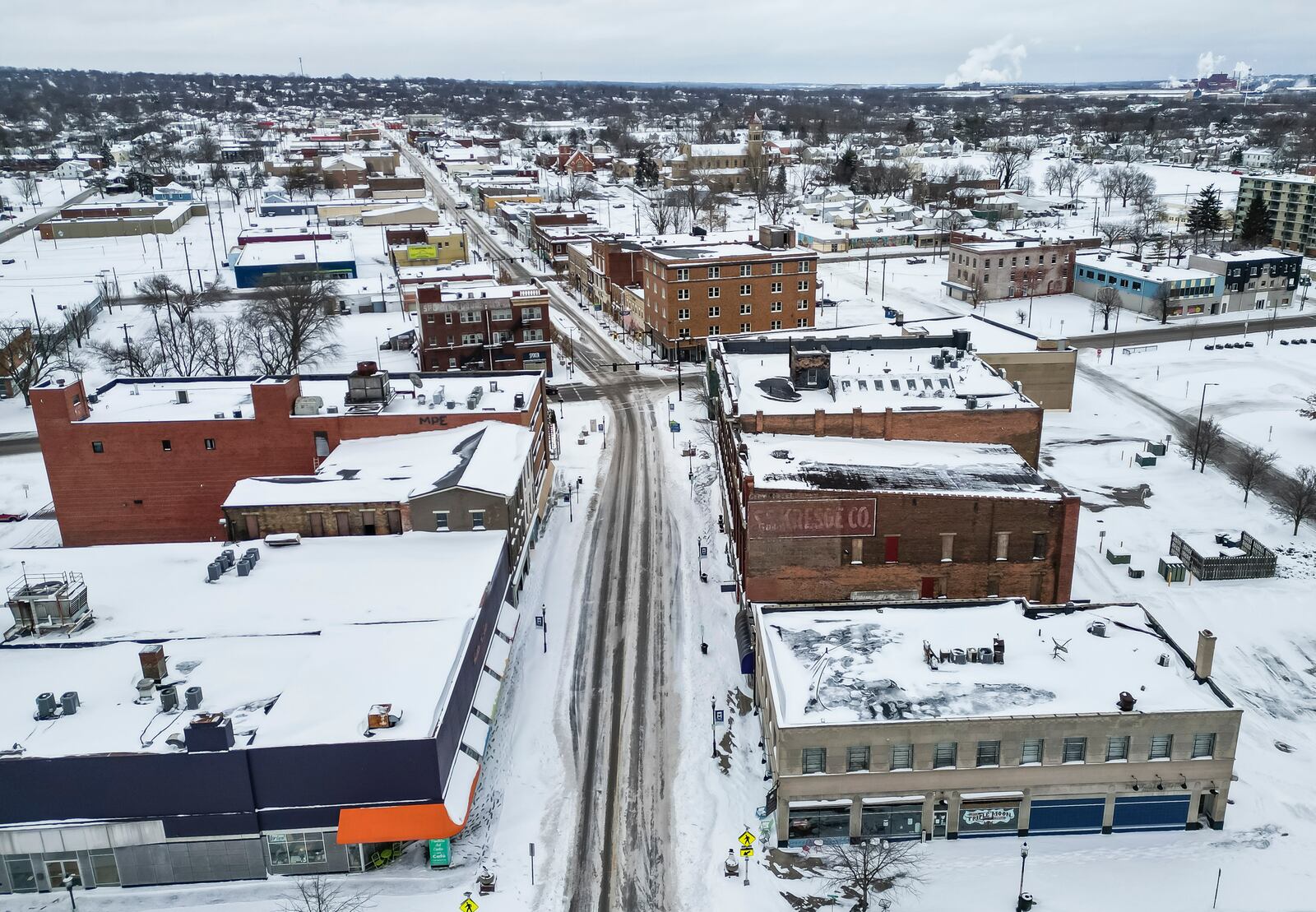 The main streets were plowed and treated with many side streets still snow cover after of several rounds of snowfall Monday afternoon, Jan. 6, 2025 in downtown Middletown. NICK GRAHAM/STAFF