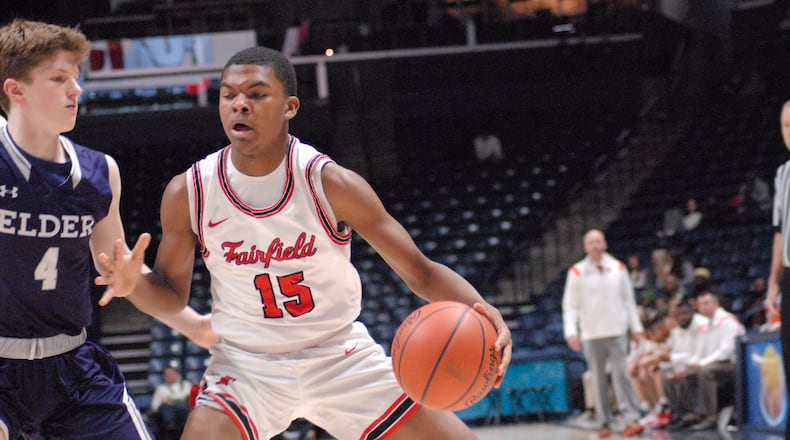 Fairfield's Cashawn Ingram drives to the hoop against Elder's Grady Wall on at Xavier University's Cintas Center on Dec. 27, 2022. Chris Vogt/CONTRIBUTED