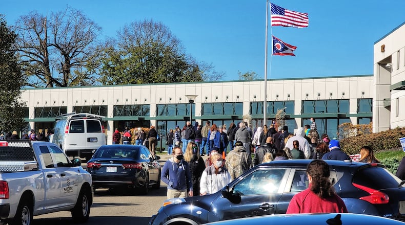 A long line forms on the last day of early voting at the Butler County Board of Elections Monday, Nov. 2, 2020 in Hamilton. NICK GRAHAM / STAFF