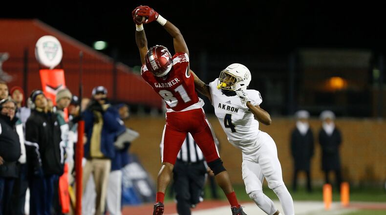 Miami University’s James Gardner (81) makes a catch while being defended by Akron’s Kyron Brown (4) during a game at Yager Stadium in Oxford on Nov. 7, 2017. MICHAEL REAVES/GETTY IMAGES