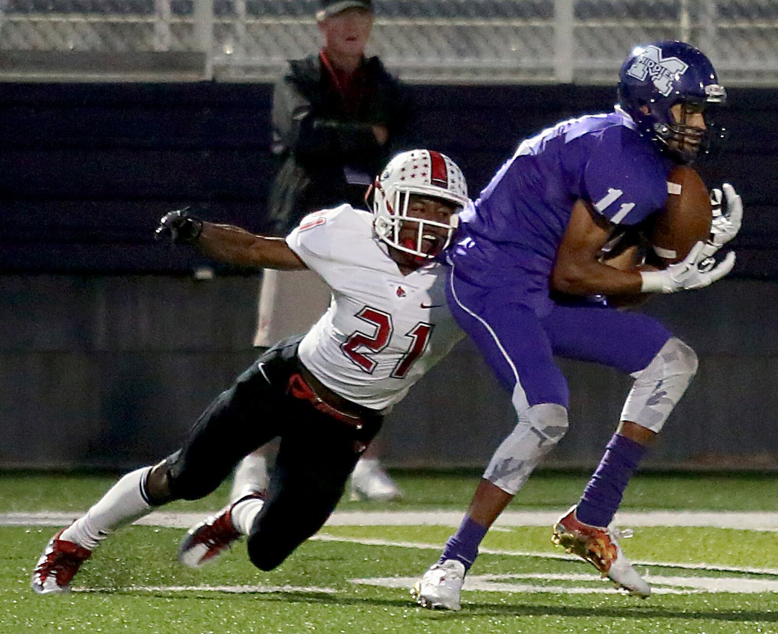 Middletown wide receiver Will Thomas catches a pass under pressure from Colerain’s Lorenzo Kendricks during a game at Barnitz Stadium in Middletown on Oct. 7, 2016. CONTRIBUTED PHOTO BY E.L. HUBBARD