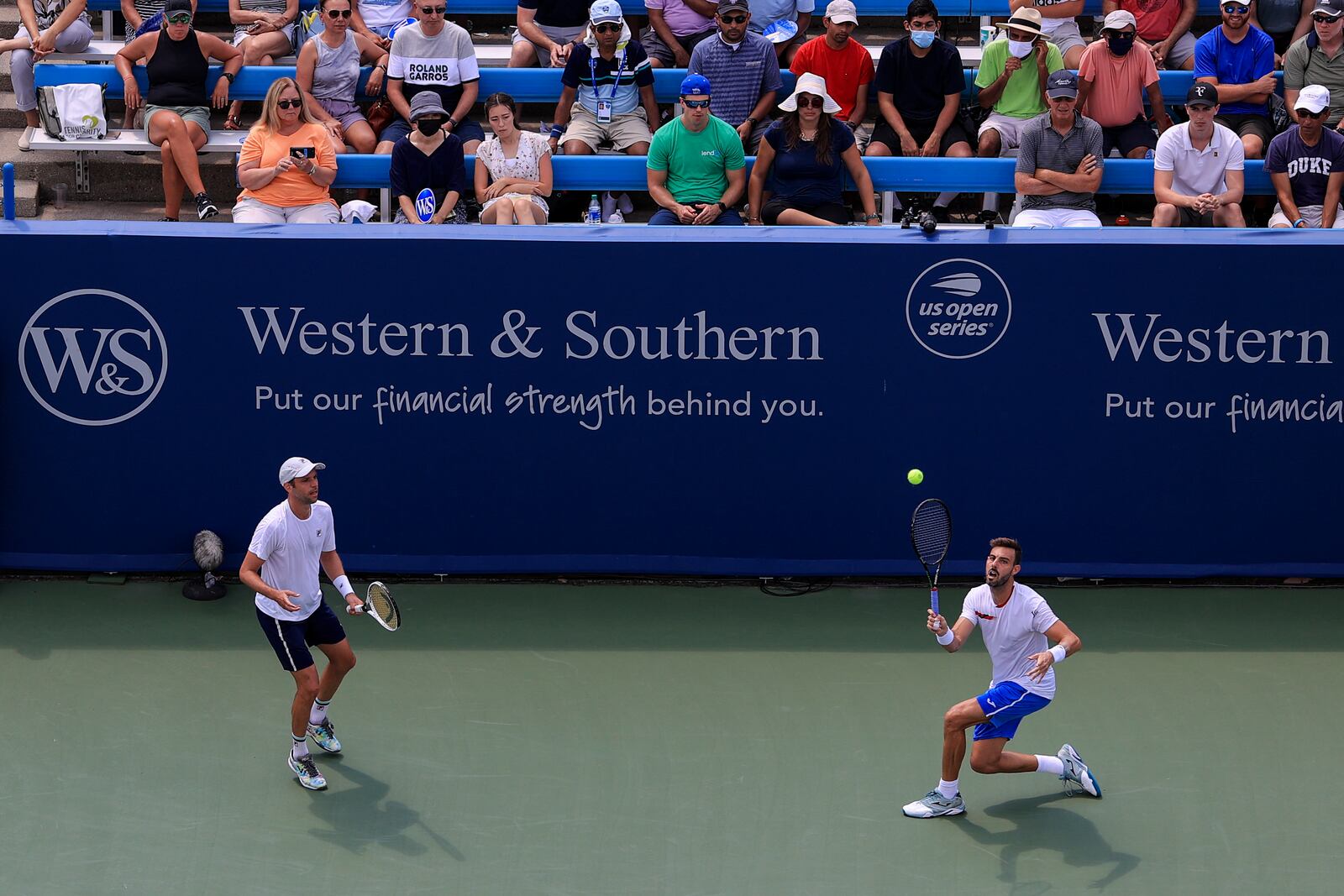 Marcel Granollers, right, of Spain, and Horacio Zeballos, left, of Argentina, play Steve Johnson and Austin Krajicek during the men's double final of the Western & Southern Open tennis tournament Sunday, Aug. 22, 2021, in Mason, Ohio. (AP Photo/Aaron Doster)