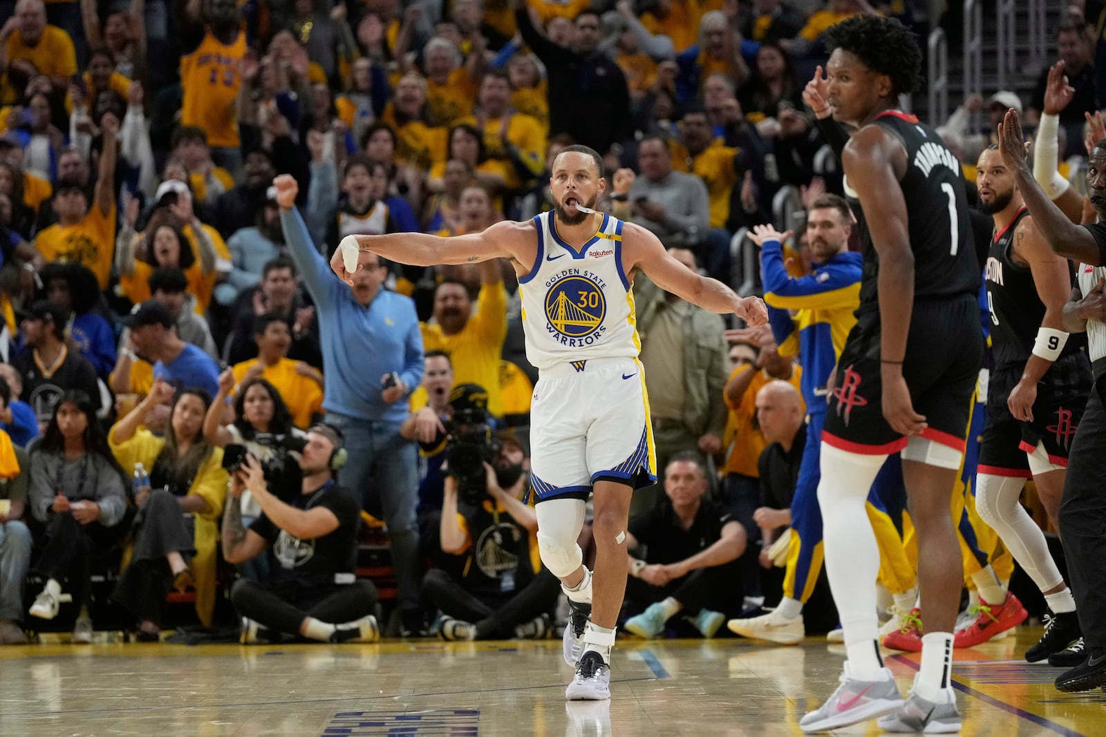 Golden State Warriors guard Stephen Curry (30) celebrates after making a 3-point basket during the second half of Game 3 of an NBA basketball first-round playoff series against the Houston Rockets in San Francisco, Saturday, April 26, 2025. (AP Photo/Jeff Chiu)