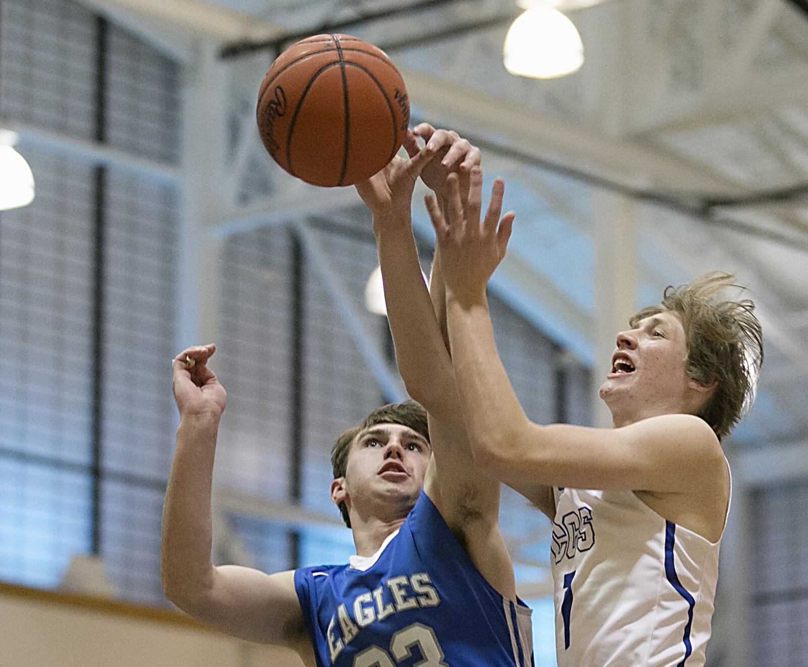 Cincinnati Christian forward Riley Reutener has his shot stopped by Middletown Christian forward Jarod Hamlin during the All-Butler County All-Star boys basketball game at the Hamilton Athletic Center on Saturday night. CONTRIBUTED PHOTO BY E.L. HUBBARD