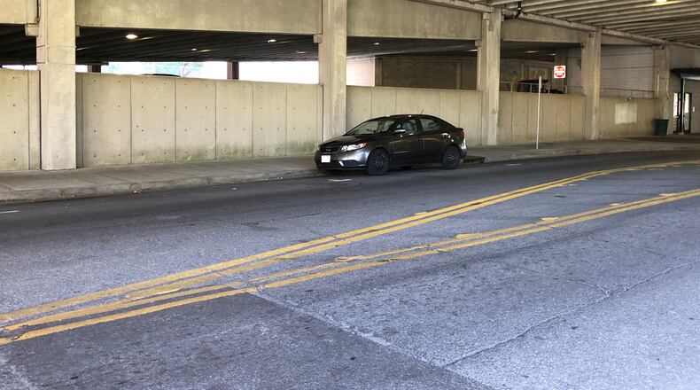 This is the area, beneath Hamilton's McDulin parking garage, where Saturday's party will happen while artists paint murals. MIKE RUTLEDGE/STAFF
