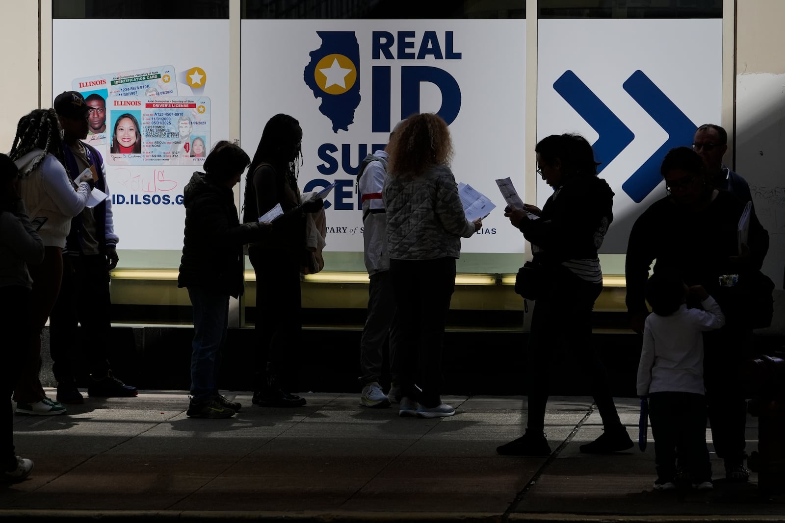 People line up to apply for Real ID at a Real ID Supercenter in downtown Chicago, Tuesday, May 6, 2025. (AP Photo/Kiichiro Sato)