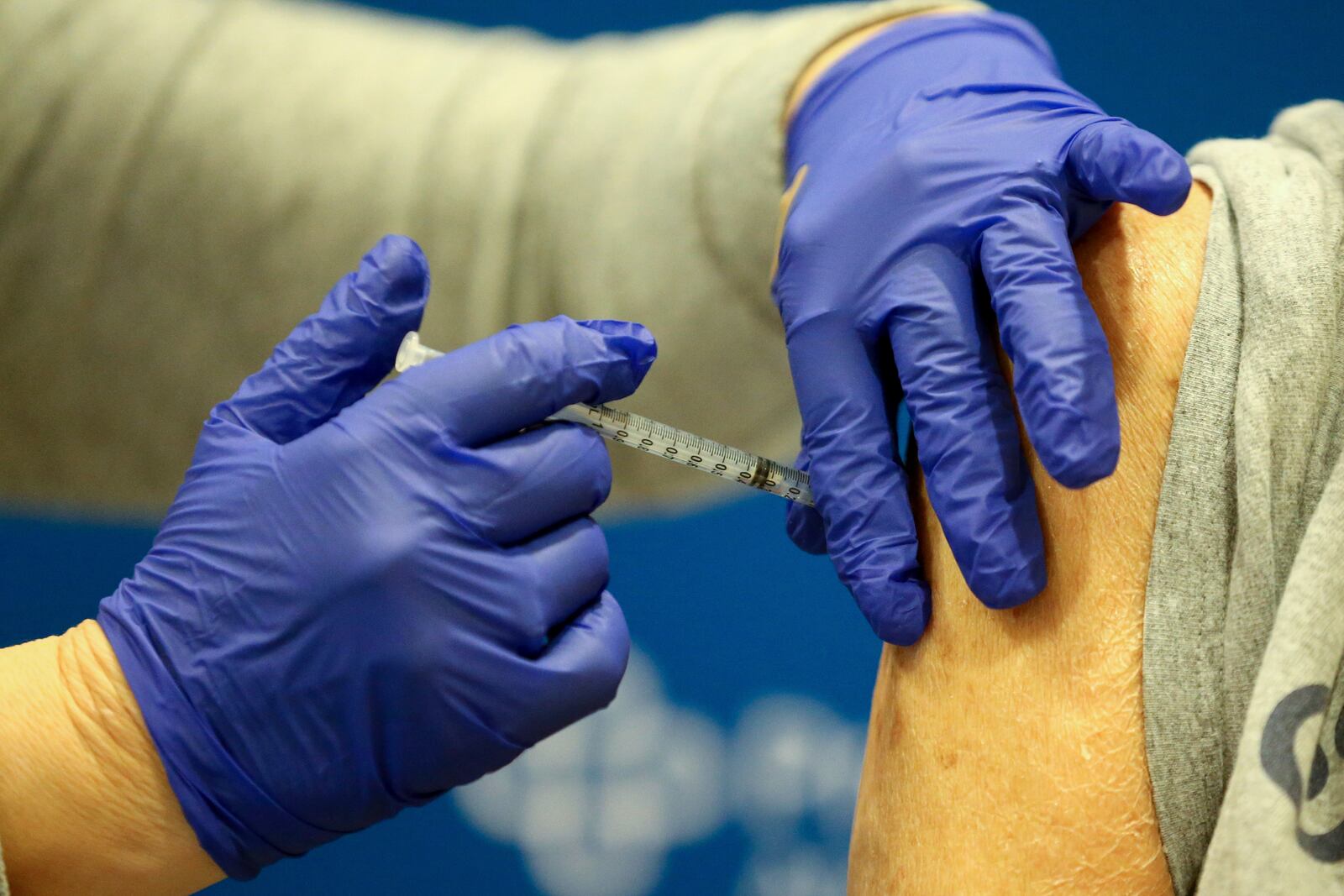 Licensed practical nurse Tami Arnold prepares to administer a vaccine, Tuesday, Jan. 19, 2021, at Atrium Medical Center in Middletown, Ohio.  (Kareem Elgazzar/The Cincinnati Enquirer via AP)