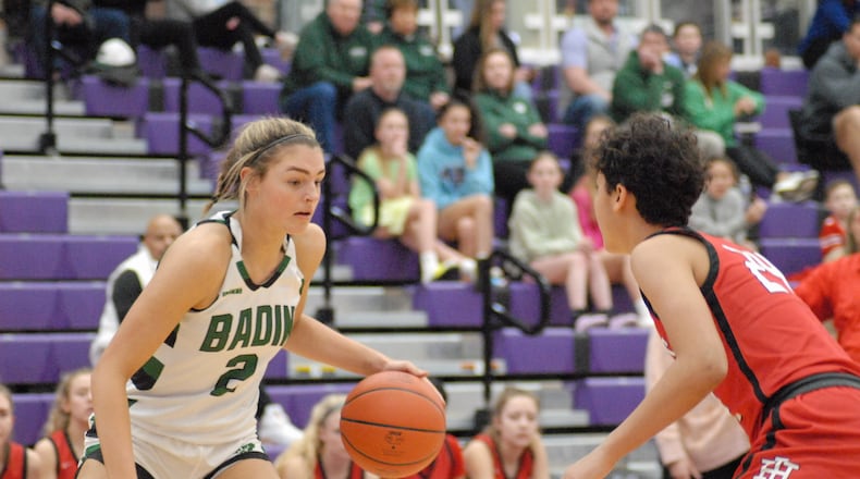 1. Badin's Braelyn Even (2) is guarded by Indian Hill's Stella Bosley (24) during their Division II sectional final contest on Tuesday night at Middletown's Wade E. Miller Arena. Even scored a game-high 22 points. Chris Vogt/CONTRIBUTED