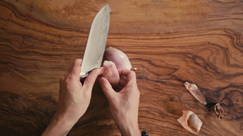 A shallot is part of Whitney Kling's "Peas and Pecorino" dish. ISTOCK