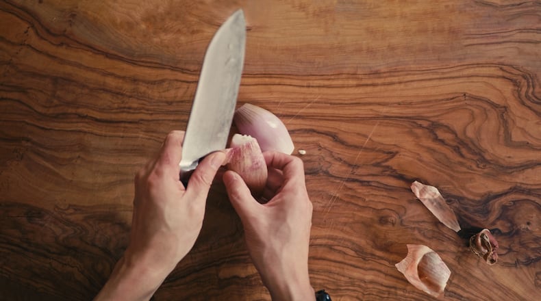 A shallot is part of Whitney Kling's "Peas and Pecorino" dish. ISTOCK