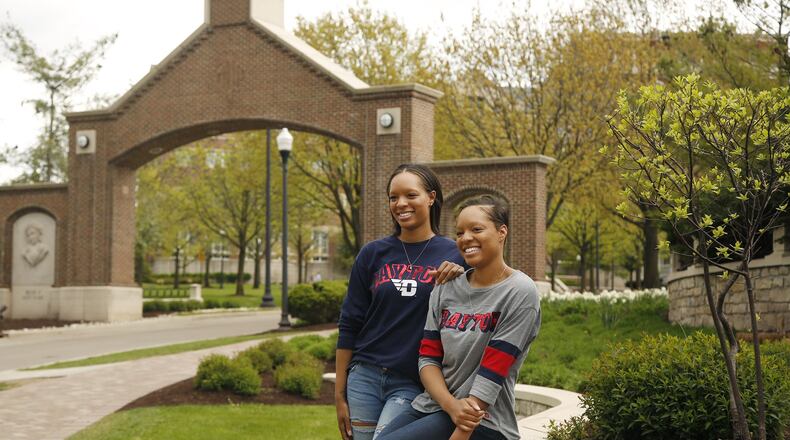 Sisters Kyler Turner, left, and Kiara Turner are graduating from The University of Dayton with degrees in early childhood education on Sunday. Their college education path started at the University of Cincinnati, then two years at Sinclair before their final two years at UD. TY GREENLEES / STAFF