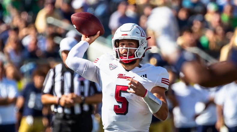 Miami (Ohio) quarterback Brett Gabbert looks to throw a pass during the first half of an NCAA college football game against Notre Dame, Saturday, Sept. 21, 2024, in South Bend, Ind. (AP Photo/Michael Caterina)