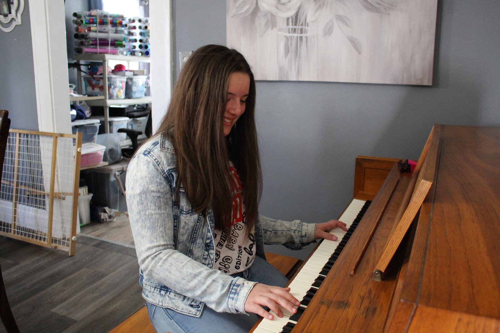 Middletown 8th grader Arelis Betancourt Franquiz returned home from her school day to find her tiny, second-hand electronic keyboard, on which she taught herself how to play piano, was replaced by a full-size piano. A local women's group heard in a Journal-News' story how the hearing-impaired girl had taught herself how to play piano while stuck at home during the coronavirus pandemic. The group arranged the surprise of a free piano and nearly a $1,000 for lessons. (Provided photo\Journal-News)