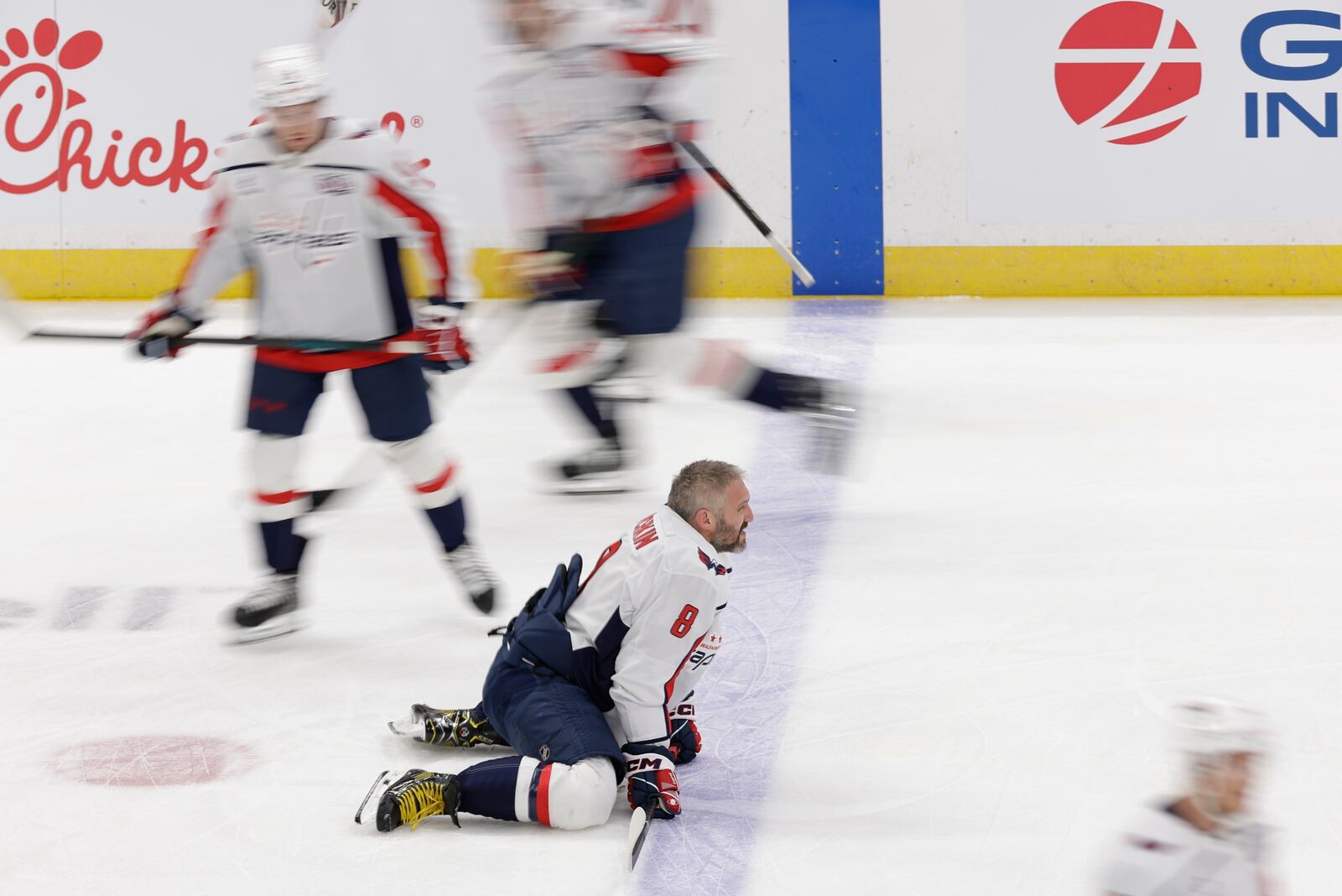Washington Capitals left wing Alex Ovechkin kneels on the ice during the warm-up before an NHL hockey game against New York Islanders in Elmont, N.Y., Sunday, April 6, 2025. (AP Photo/Adam Hunger)