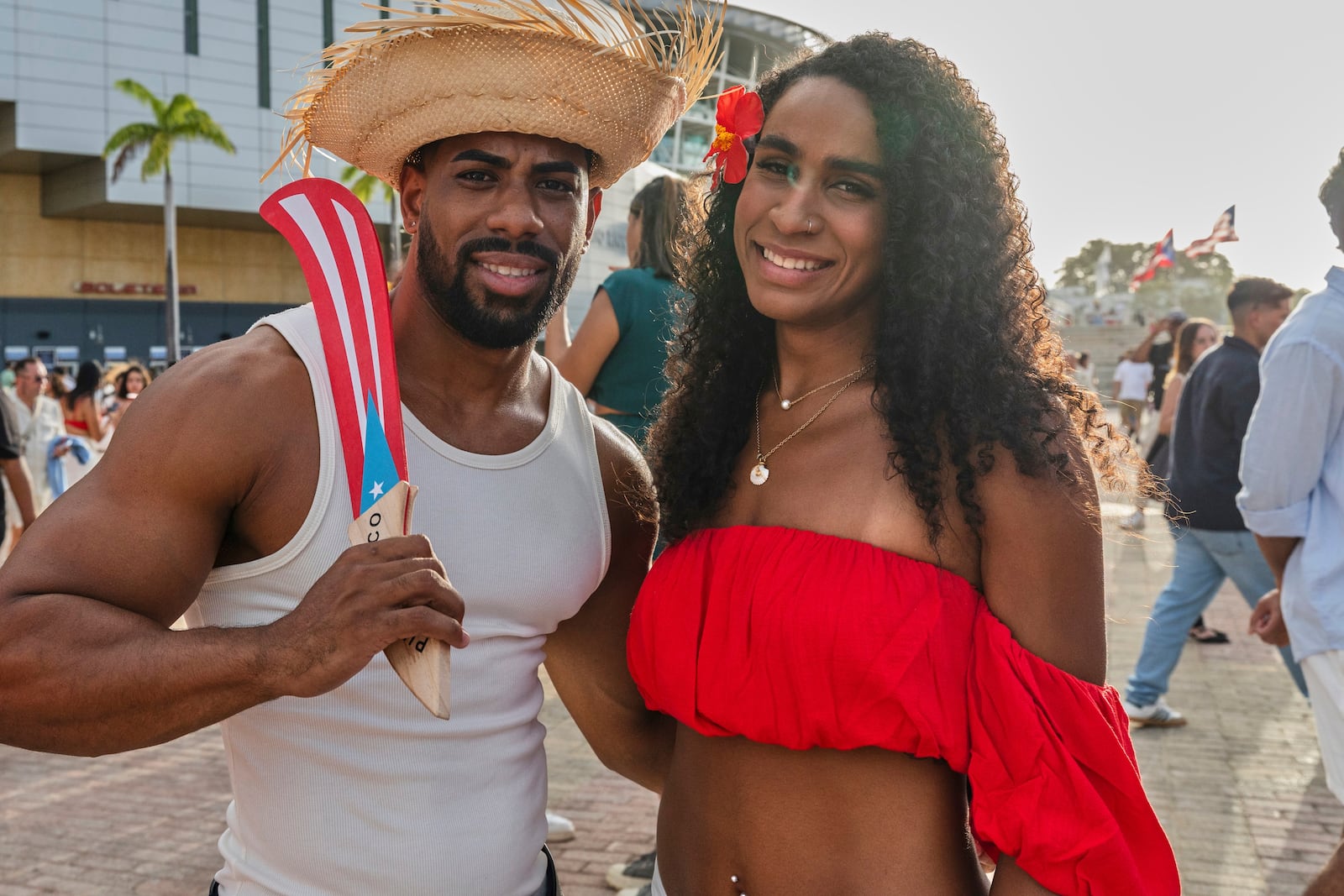 Bad Bunny fans pose for a photo before attending his first show of the 30-date concert residency at the Coliseo de Puerto Rico Jose Miguel Agrelot in San Juan, Puerto Rico, Friday, July 11, 2025. (AP Photo/Alejandro Granadillo)