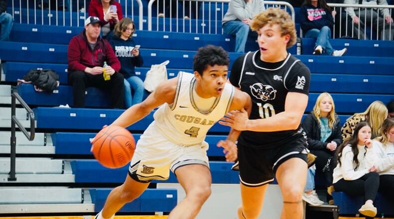 Edgewood's Amir Cannedy (4) is guarded by Badin's Ben Sakach (10) on Friday. Chris Vogt/CONTRIBUTED
