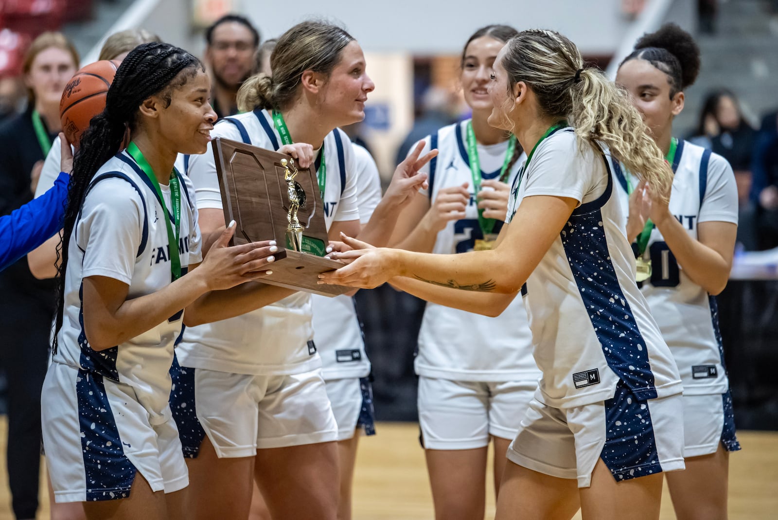 The Fairmont High School girls basketball accepts trophy after beating Olentangy 66-45 to win the Division I, Region 2 championship on Friday, March 6, 2026 at the Ohio Expo Center's Taft Coliseum. MICHAEL COOPER / STAFF