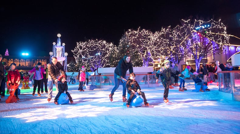 Kings Island WinterFest 2023 has 20 rides open, just as many live entertainment shows, crafts for kids, a sledding hill, ice skating and more. The Eiffel Tower is lit as a giant Christmas tree and there is a nightly holiday parade. WinterFest is open on select nights through the end of December. PHOTOS: KINGS ISLAND/CONTRIBUTED