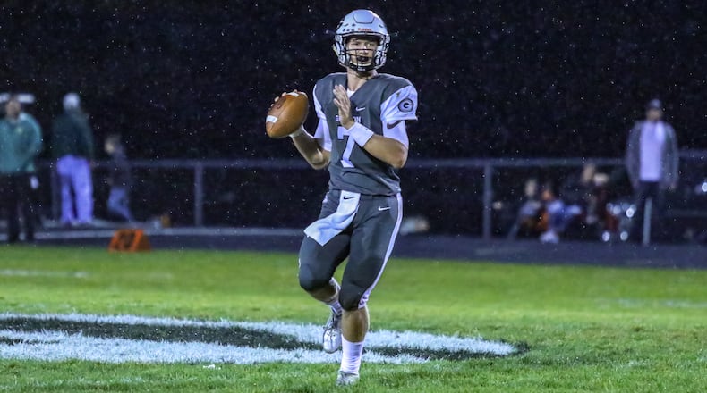 Greenon High School quarterback Cade Rice rolls out to throw a pass during their game against Madison Plains on Friday night at Greenon Stadium. The Knights won 24-16. CONTRIBUTED BY MICHAEL COOPER