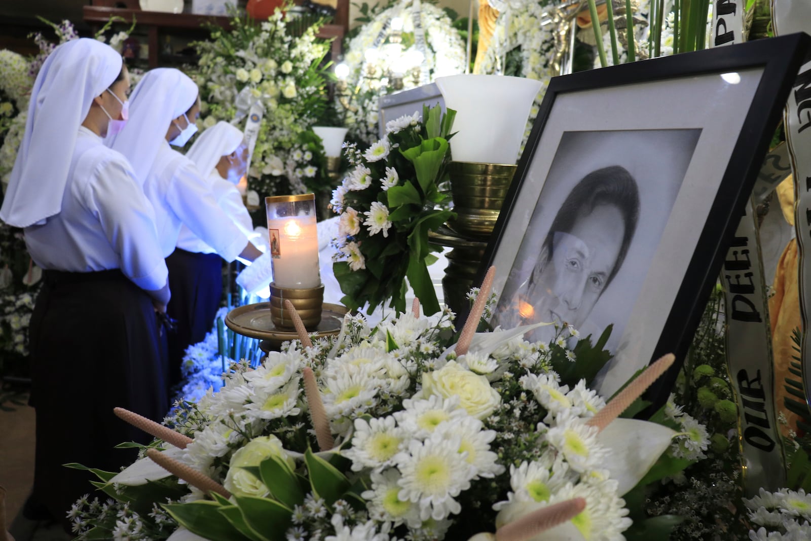 FILE - Catholic nuns visit the wake of Negros Oriental Gov. Roel Degamo at his home in Dumaguete city, central Philippines on March 6, 2023. (AP Photo/Alan Tangcawan, File)