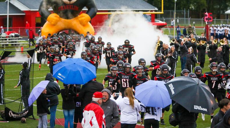 Franklin players take the field for their game against Edgewood at Atrium Stadium in Franklin on Sept. 1. The host Wildcats posted a 49-21 victory. GREG LYNCH/STAFF