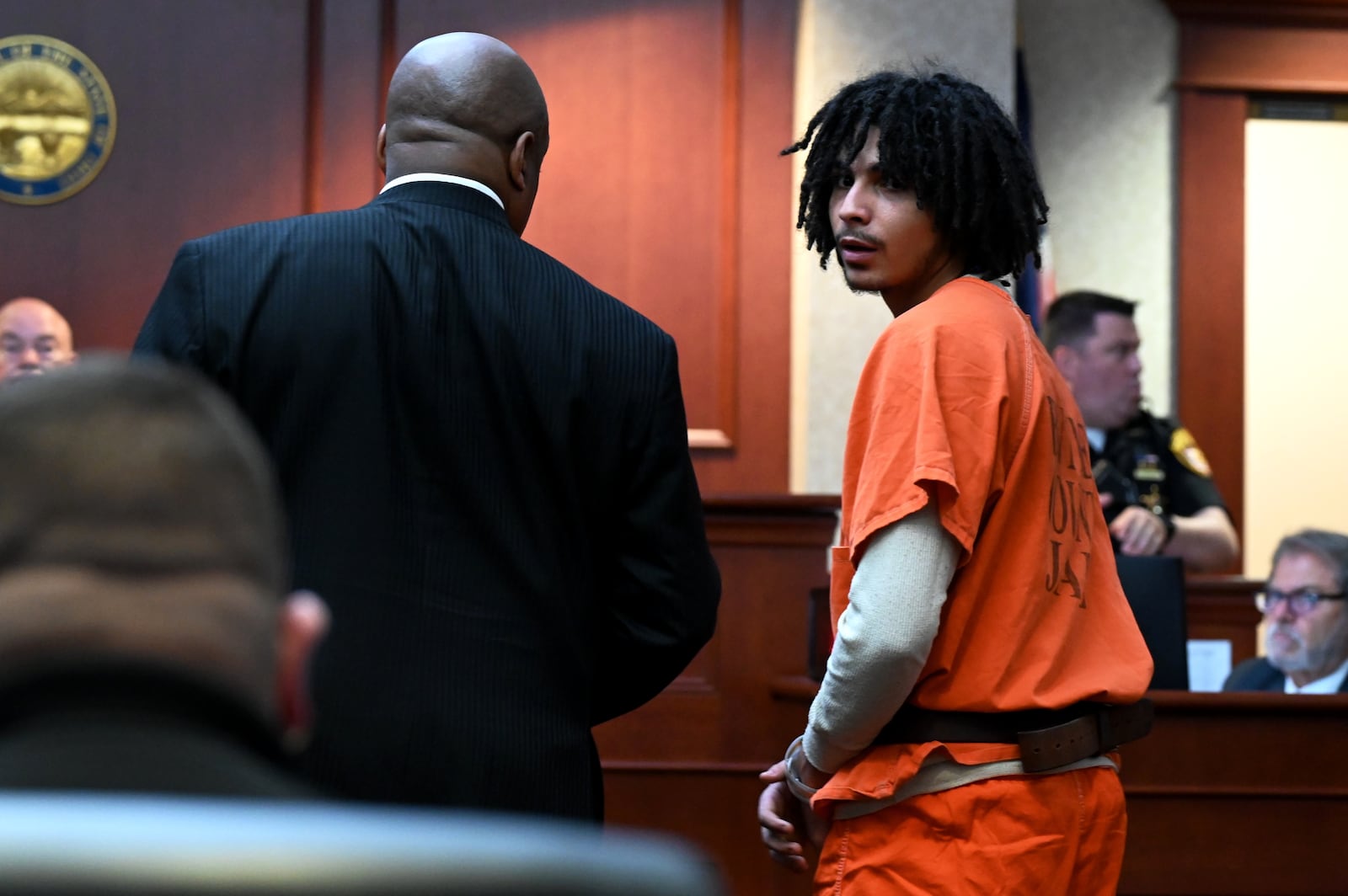 Keatrick Thomas, 19, of Middletown, pleaded guilty Thursday afternoon, May 1, 2025, on an aggravated burglary charge with a weapons specification. He and his co-defendant, Lemond Chambers, 20, of Middletown, are to be sentence on June 12. Pictured is Keatrick looking back at friends and family in the courtroom as he heads out. MICHAEL D. PITMAN/STAFF