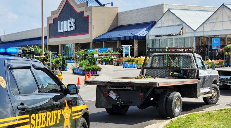A man allegedly wanted on felony warrants ran from his truck at Lowe's in Hamilton Thursday afternoon. NICK GRAHAM/STAFF