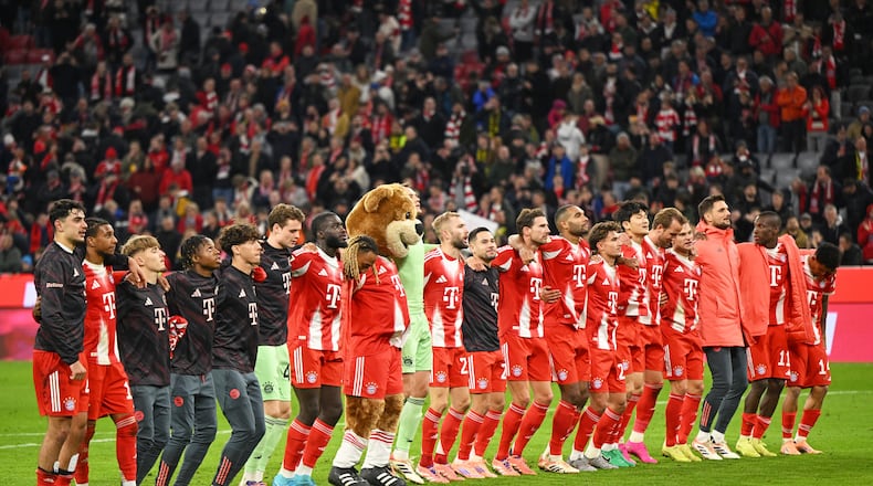 Bayern Munich players celebrate their victory after the Bundesliga soccer match between Bayern Munich and Borussia Dortmund in Munich, Germany, Saturday, Oct. 18, 2025. (AP Photo/Lennart Preiss)