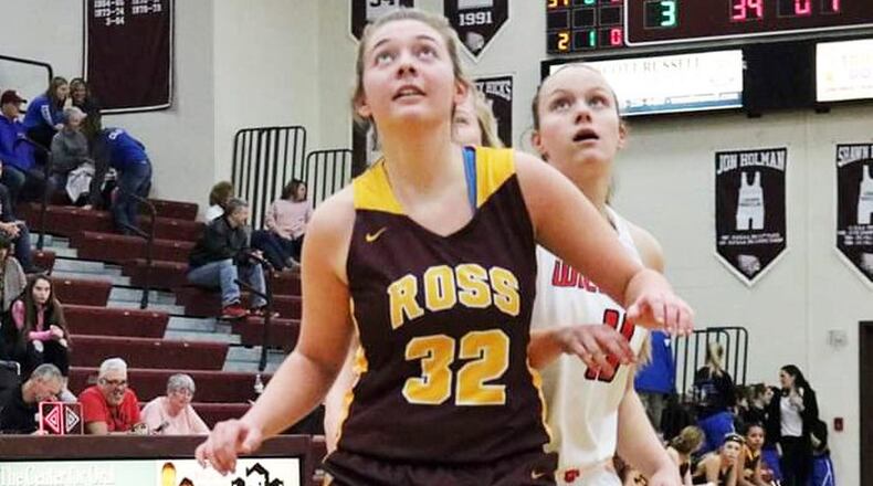 Dakota Snyder (32) of Ross and Kristin Earles (11) of Franklin keep their eyes on the ball Saturday afternoon during a Division II sectional opener at Lebanon. Franklin won 53-16. CONTRIBUTED PHOTO BY TERRI ADAMS