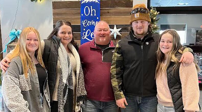 Ross High School football coach Kenyon Commins is pictured with his wife, Monica, and daughters, Kaylin and Kenley, and son, Kolton. The Commins family has been receiving support from local school communities during Kenley's battle with lymphoma. CONTRIBUTED