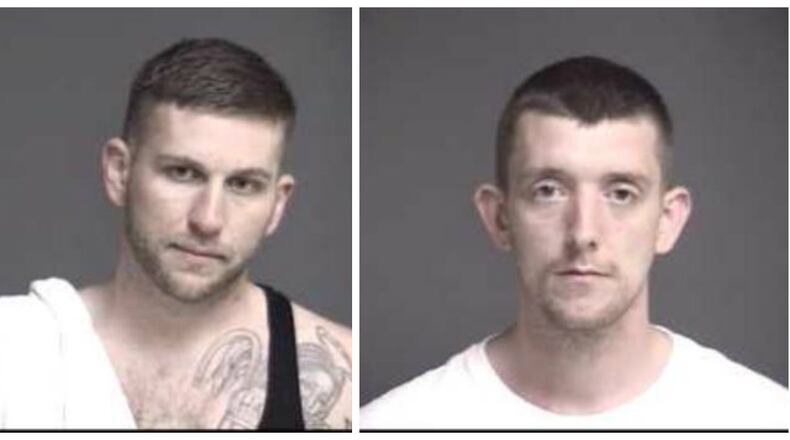 Daniel Hatfield Jr. and Jeremy Mink remained in the Warren County Jail today awaiting arraignment on charges of escape from a state community corrections center on Ohio 63, across from two state prisons.
