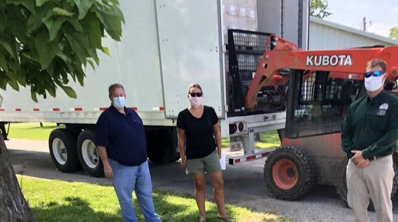 School and county emergency officials recently oversaw the delivery of 300,000 coronavirus protective masks that will soon be distributed to schools throughout Butler County and southwest Ohio. From left to right: Butler County Educational Services Center (BCESC) Treasurer Ken Ulm, BCESC Director of Public School Safety Katharine Clayton, Butler County Emergency Management Agency Director Matt Haverkos. (Provided Photo\ Journal-News)