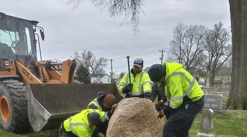 City of Middletown employees recently set a rock at the Middletown Cemetery on First Avenue that will honor the 233 veterans buried there. SUBMITTED PHOTO