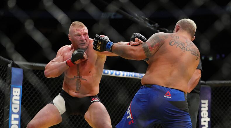 LAS VEGAS, NV - JULY 9: Brock Lesnar punches Mark Hunt (R) during the UFC 200 event at T-Mobile Arena on July 9, 2016 in Las Vegas, Nevada. (Photo by Rey Del Rio/Getty Images)