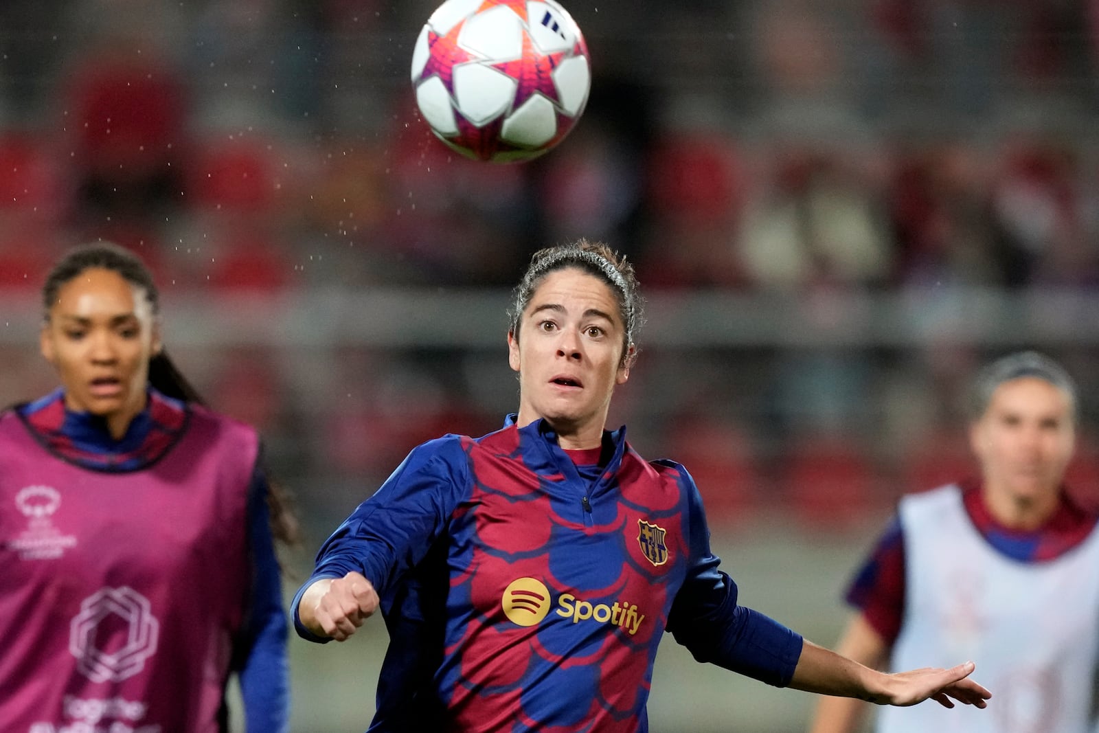 FILE - Barcelona's Marta Torrejon eyes the ball during warmup before the women's Champions League group A soccer match between SL Benfica and FC Barcelona at the Benfica Campus in Seixal, outside Lisbon, Jan. 31, 2024. (AP Photo/Armando Franca, File)