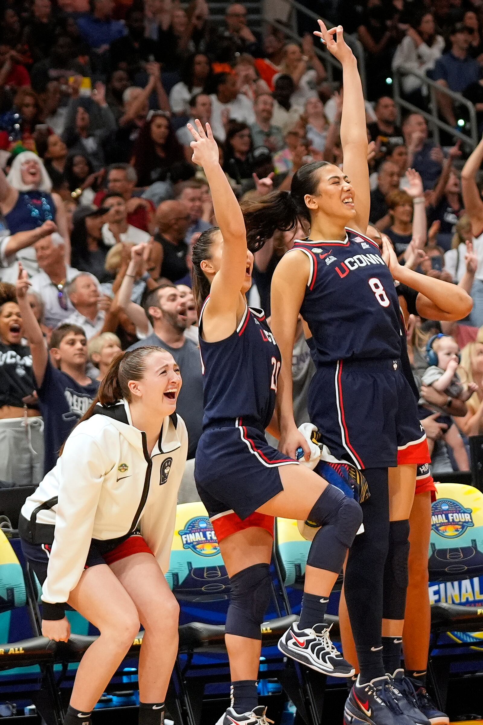 UConn players react late in the second half of the national championship game against South Carolina at the Final Four of the women's NCAA college basketball tournament, Sunday, April 6, 2025, in Tampa, Fla. (AP Photo/John Raoux)
