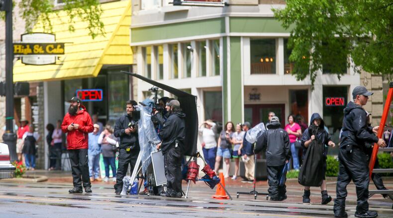 A film crew sets up a scene for “The Old Man and the Gun” for filming April 27 in Hamilton. GREG LYNCH / STAFF