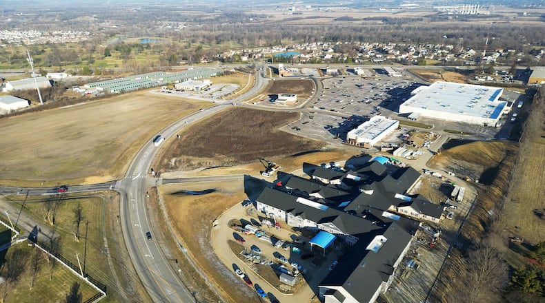 Officials with a Cincinnati-based development company will soon break ground on their first project in Liberty Twp. after a $1.3 million purchase of land near SR 4, bring more businesses and jobs to the area. The 5.83-acre, mixed-use project near to the current Shoppes at Kyles Station complex will see a 22,000-square-foot retail strip that will eventually house more than a dozen businesses in three buildings, said Jeff Baumgarth, vice president of The Myers Y. Cooper Company. The new development, pictured in the upper left corner off of Kyles Station Road, will open late 2023 or early 2024. (PHOTO BY NICK GRAHAM\Journal-News)