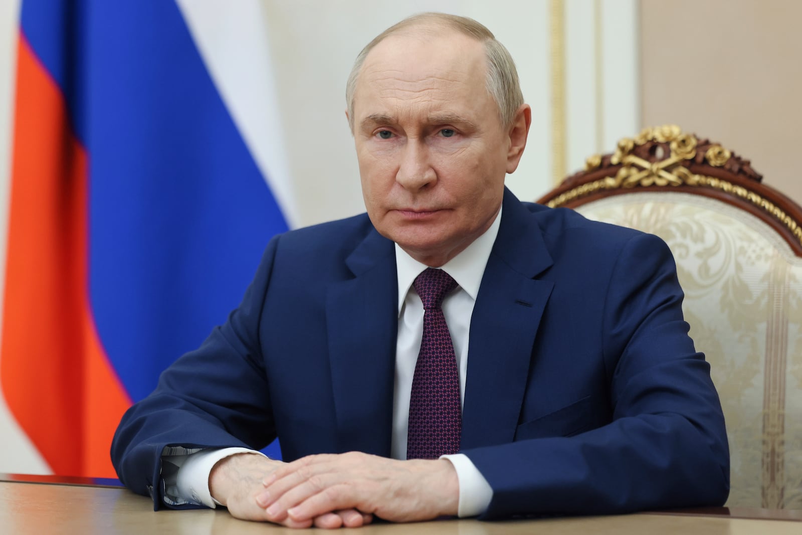 Russian President Vladimir Putin pauses, during a video address to commemorate Russian Navy Day at the Kremlin in Moscow, Russia, Sunday, July 27, 2025. (Mihail Metzel, Sputnik, Kremlin Pool Photo via AP)
