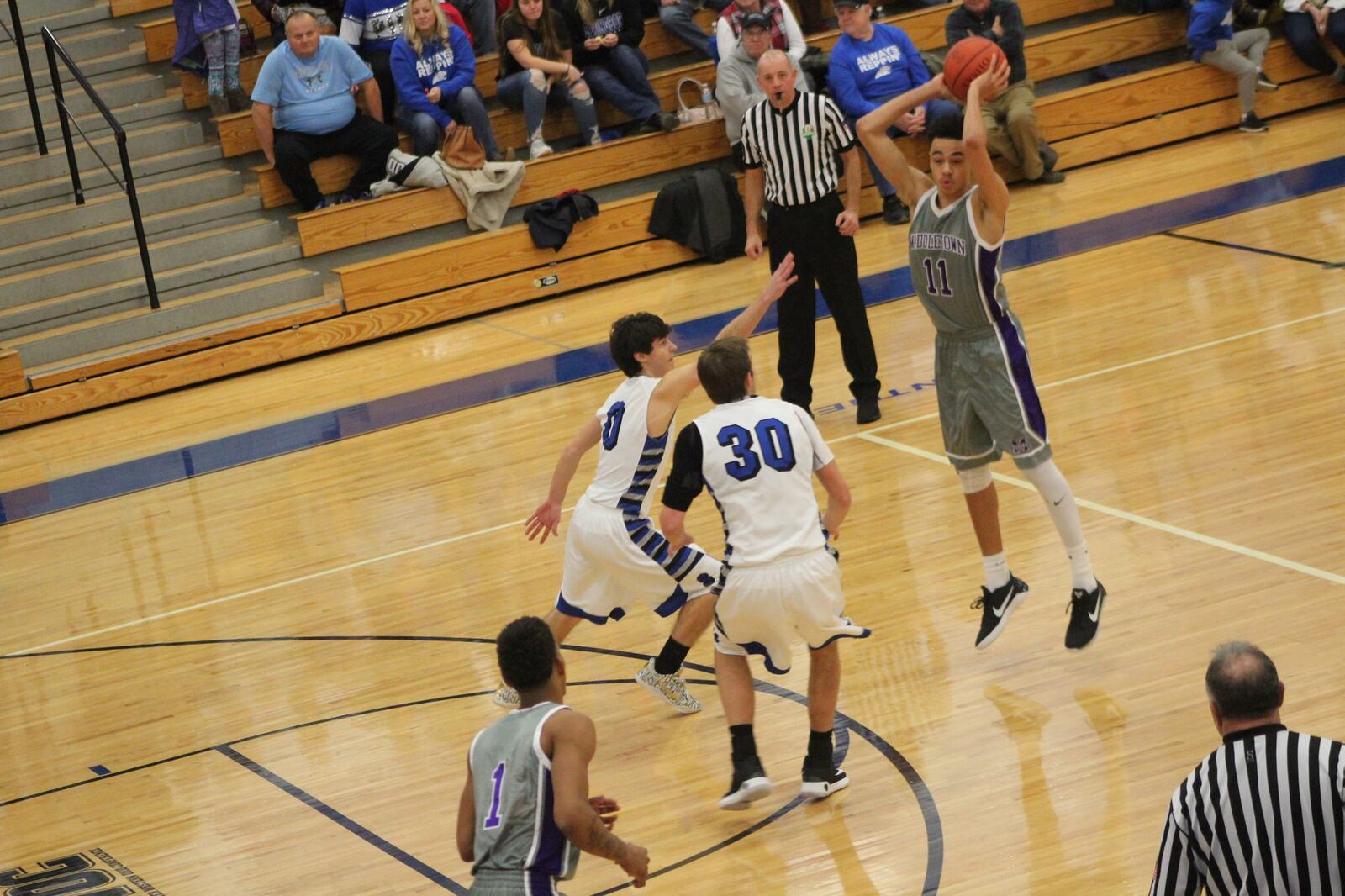 Middletown’s Cliff Snow (11) looks to make a pass as Springboro’s Christian James (0) and Trey Varinsky (30) defend Saturday night at Springboro. CONTRIBUTED PHOTO BY MARITZA MCKINNEY