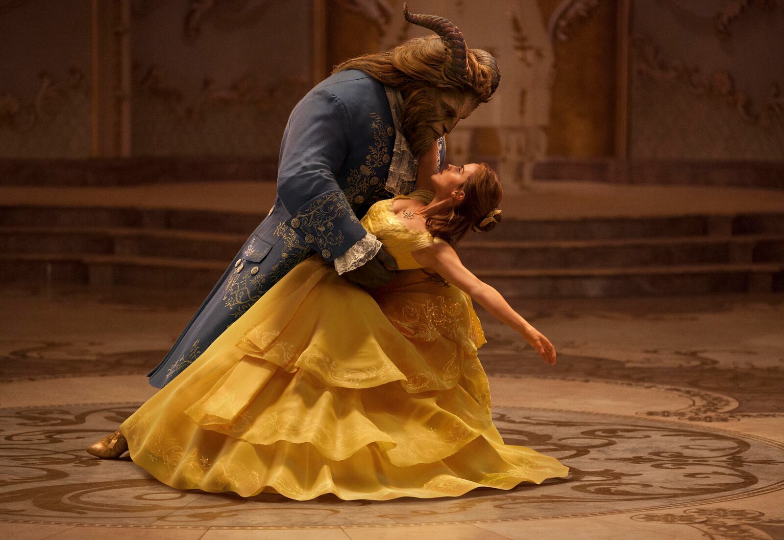 This image released by Disney shows Dan Stevens as The Beast, left, and Emma Watson as Belle in a live-action adaptation of the animated classic "Beauty and the Beast." 