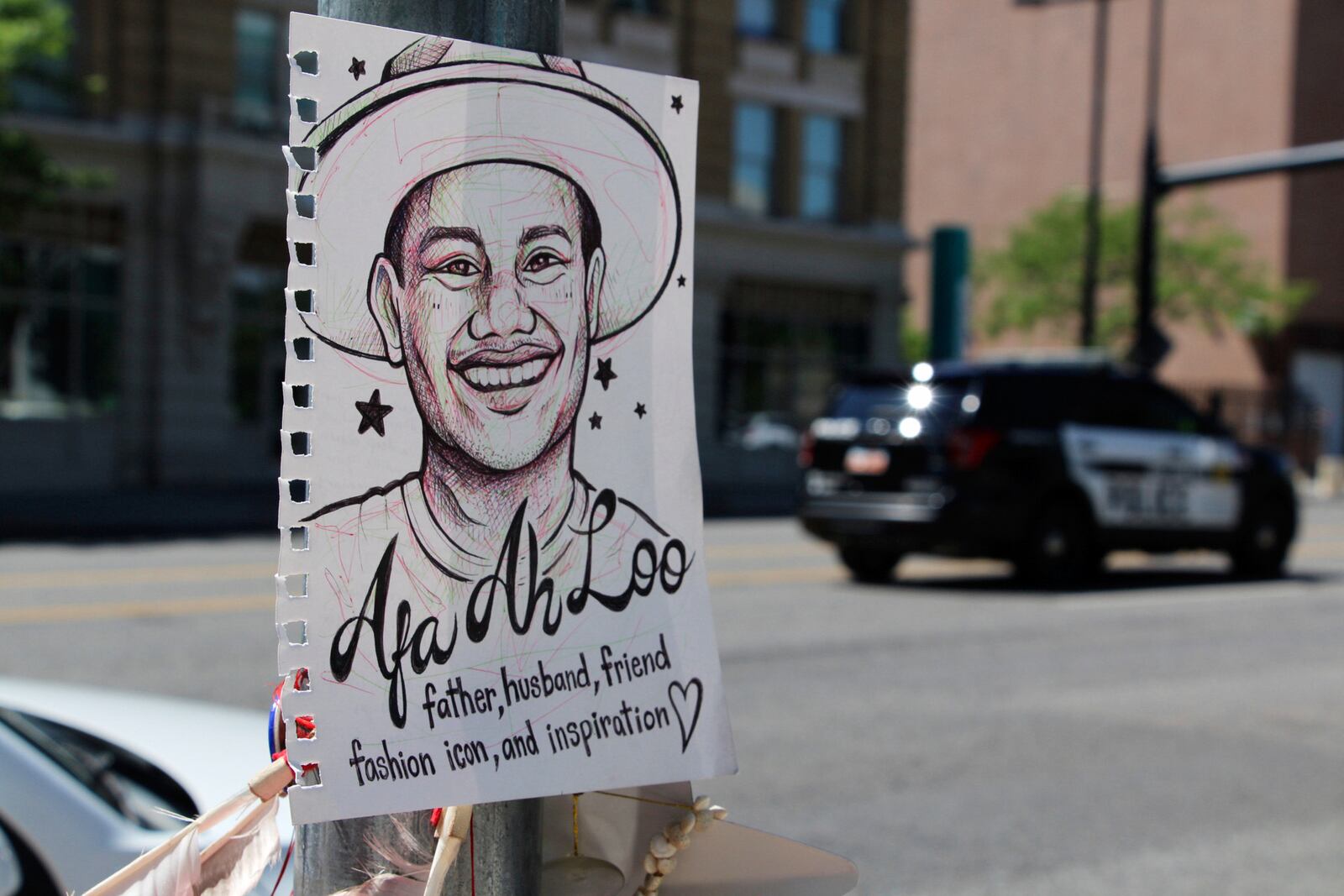 A makeshift memorial for Arthur Folasa Ah Loo, known to friends and family as Afa, is seen Tuesday, June 17, 2025, in downtown Salt Lake City, Utah, on the block where Ah Loo was fatally shot during a "No Kings" protest on Saturday, June 14. (AP Photo/Hannah Schoenbaum)