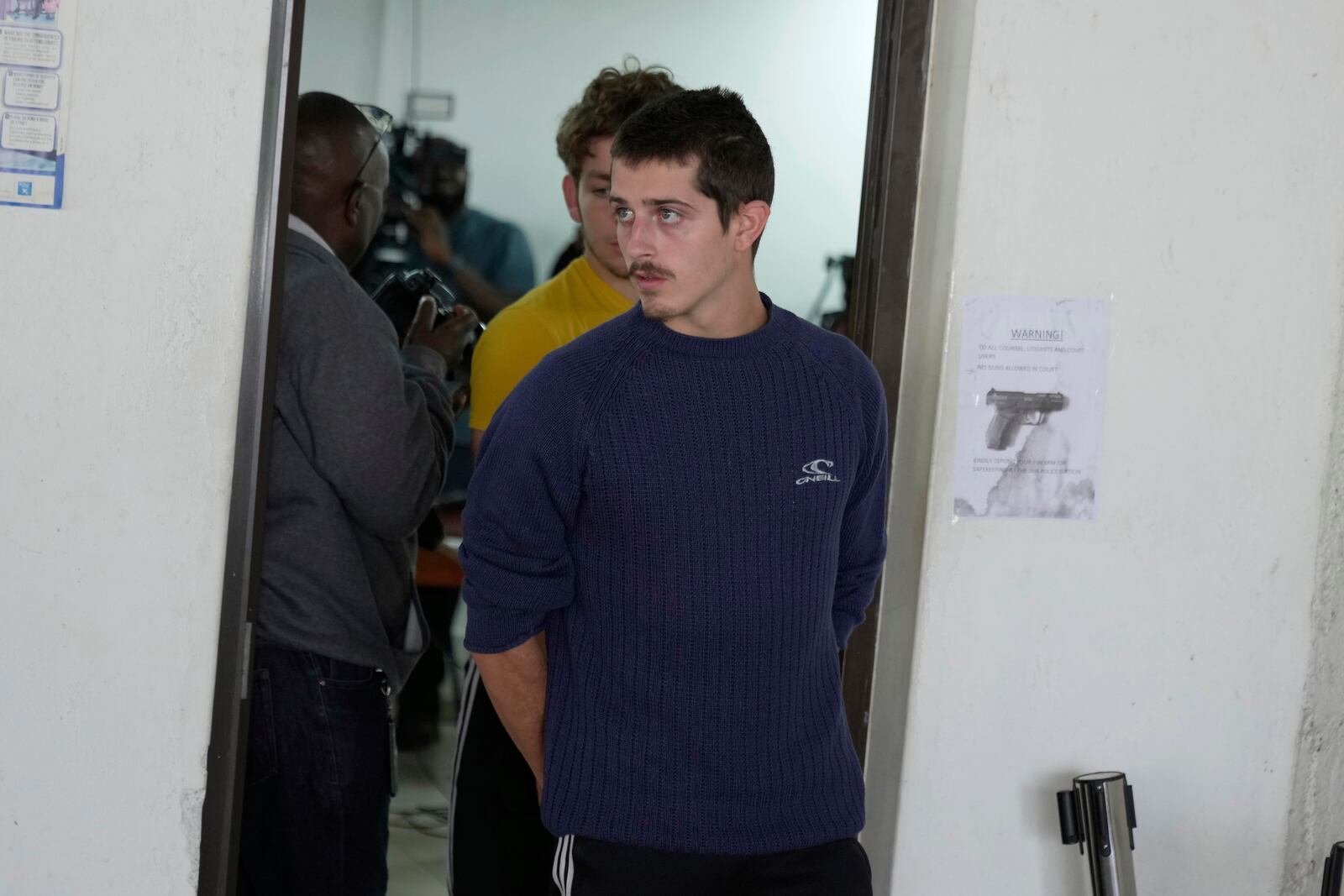 Belgian national Seppe Lodewijckx, walks out of the Jomo Kenyatta International Airport Law Courts in Nairobi, Kenya, Wednesday, April 23, 2025. (AP Photo/Brian Inganga)