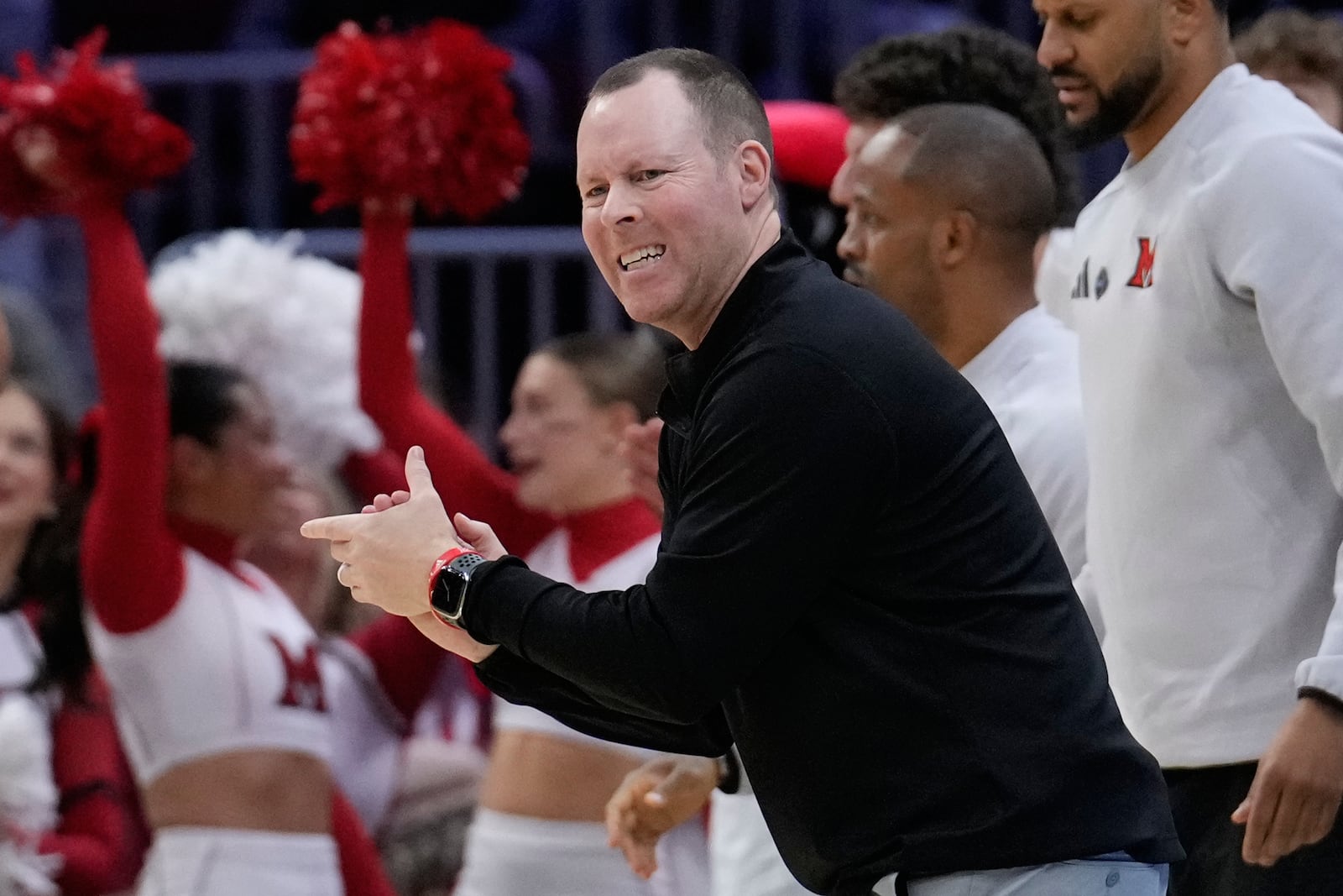 Miami (Ohio) head coach Travis Steele on the sidelines in the first half of a basketball game against Massachusetts in the quarterfinals of the Mid-American Conference tournament, Thursday, March 12, 2026, in Cleveland. (AP Photo/Sue Ogrocki)