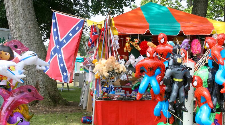 In 2006, the Confederate flag was repeatedly seen at the Butler County Fair in the form of hats, T-shirts, belt buckles, and even a Confederate flag used in a horse saddle design. Booths at the fairgrounds had their share of Confederate merchandise, too, including games where people could win large Confederate flags to small mirrors bearing the Confederate flag. GREG LYNCH / STAFF FILE 2006