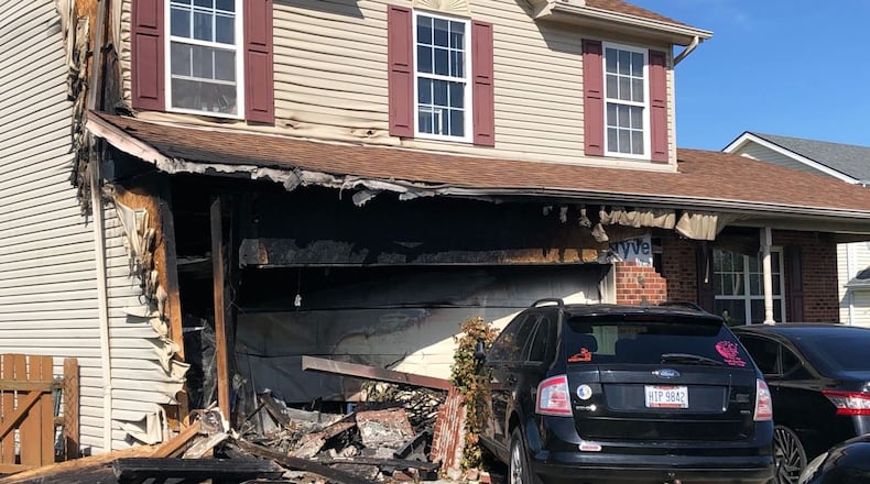 The driver of a van that crashed into a house and caught on fire is dead after they were unable to get out of the vehicle when it engulfed in flames on Sunday. LOT TAN / WCPO-TV