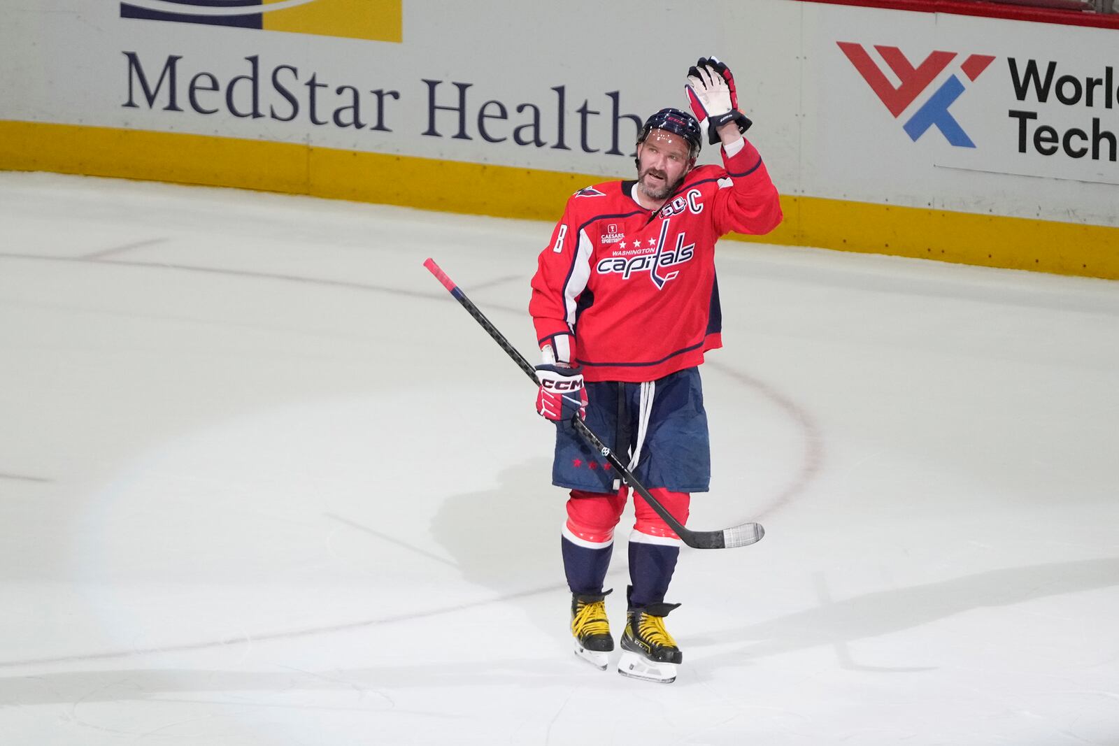 Washington Capitals left wing Alex Ovechkin (8) waving to the crowd at the end of an NHL hockey game against the Chicago Blackhawks, Friday, April 4, 2025, in Washington. (AP Photo/Mark Schiefelbein)