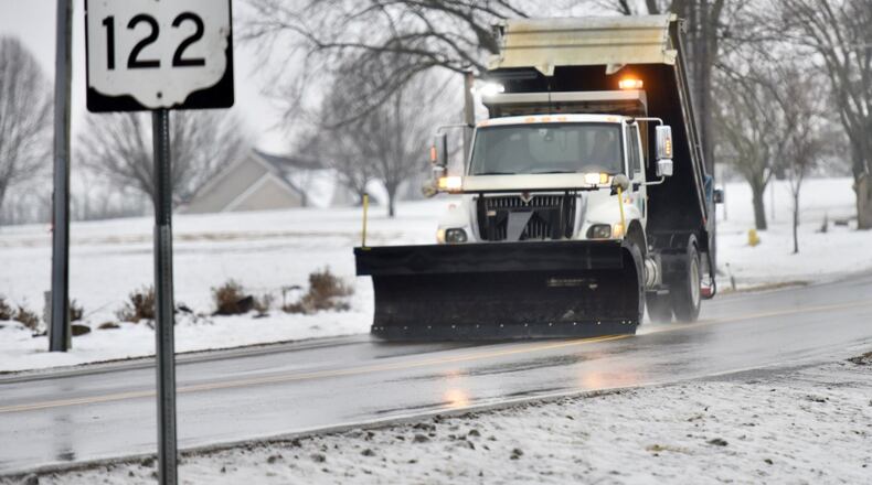 Salt trucks and snow plows worked on roads as a wintry mix fell on the area on Monday, Jan. 8, 2018. NICK GRAHAM / STAFF